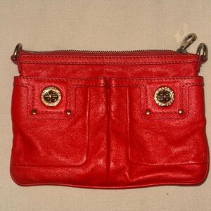 Bright red/orange Marc by Marc Jacobs Crossbody approx 4”x12” strap approx 52”